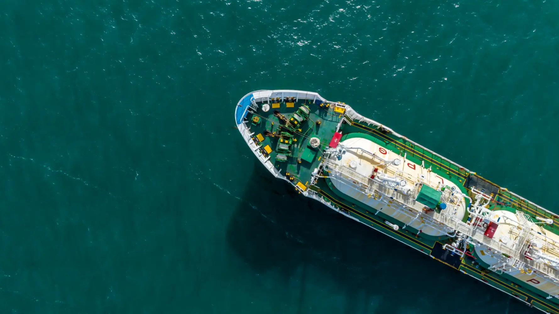 Aerial top view of an LPG gas tanker ship navigating open sea waters