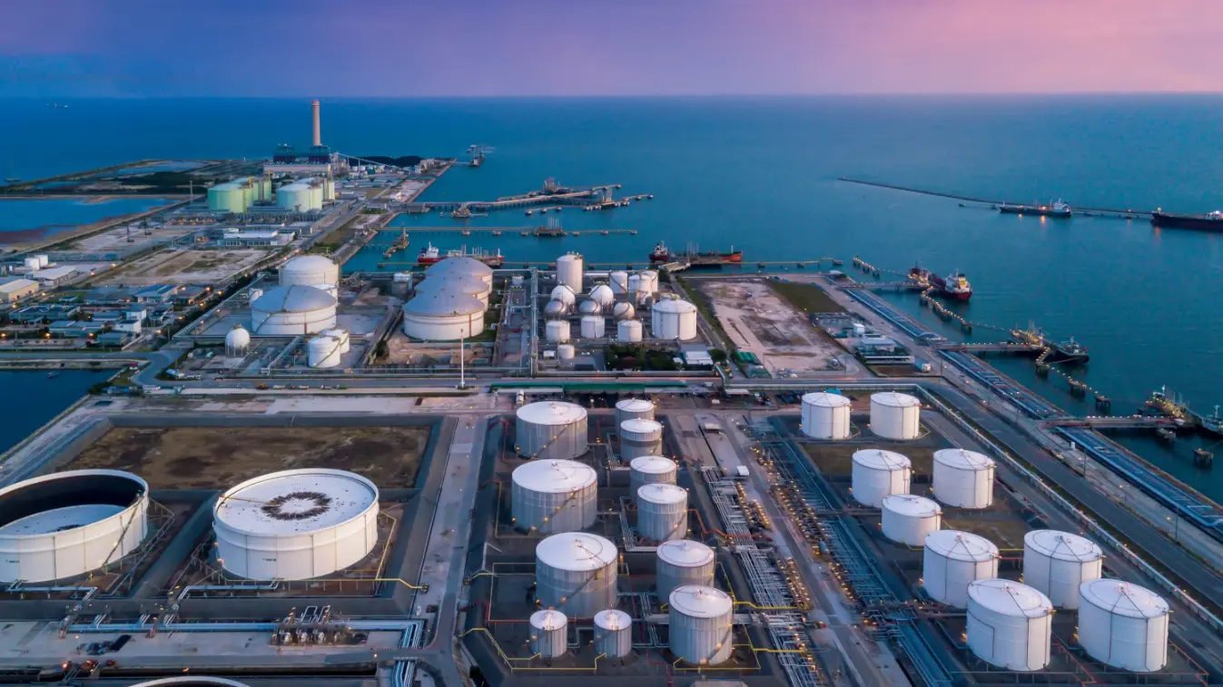 Aerial view of an oil and gas refinery plant within an industrial zone