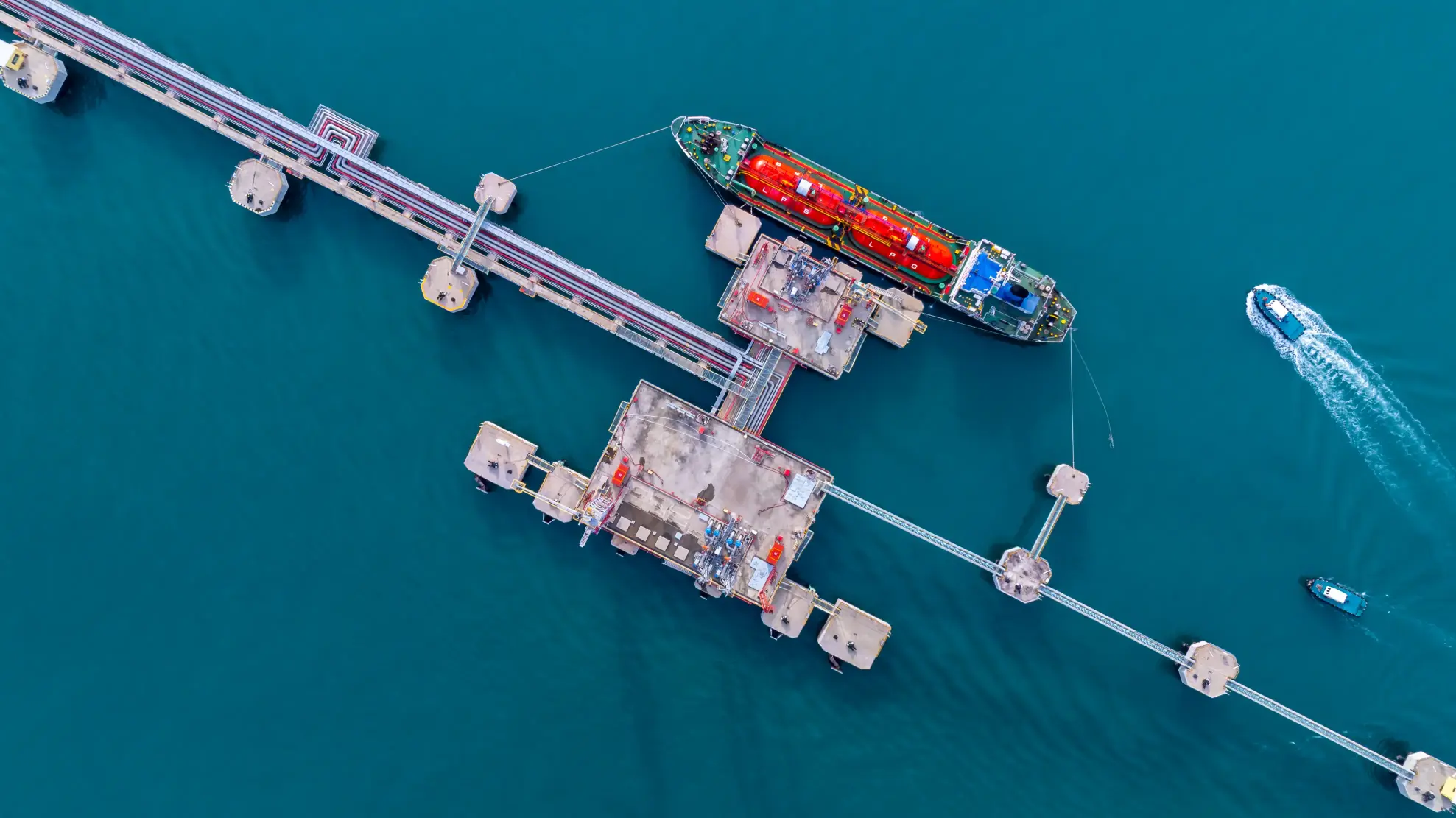 Aerial view of an LPG gas tanker ship docked at a marine terminal